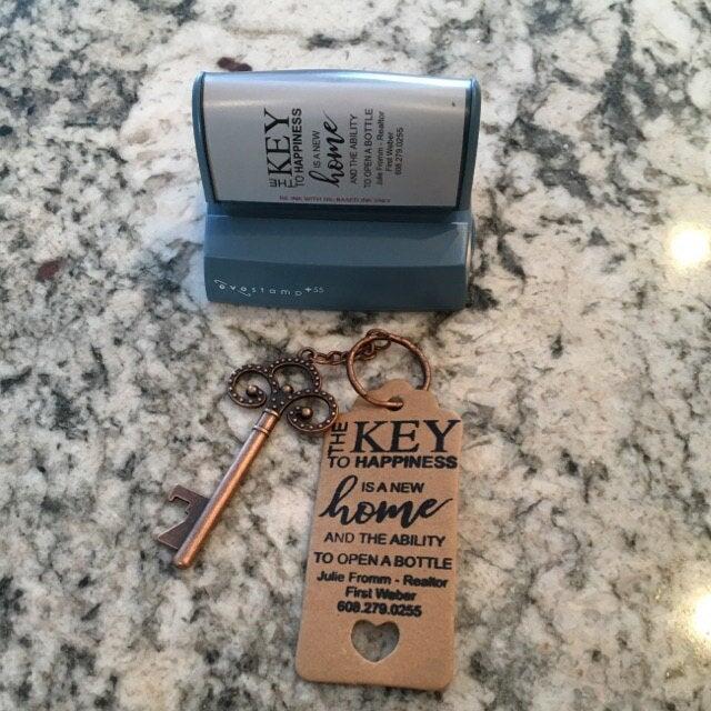 picture of a pre-inked stamp and brown tag with black ink impression